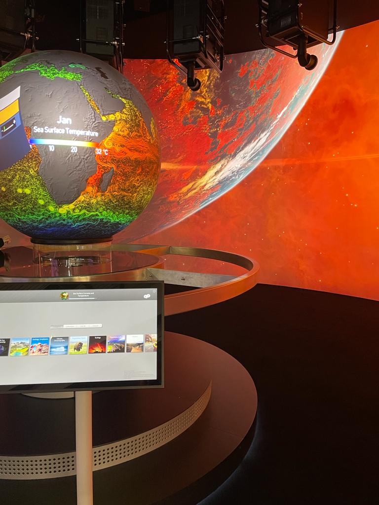 Visitors viewing OmniGlobe installation